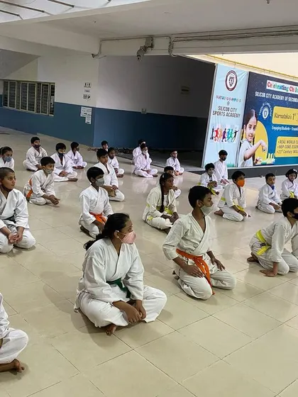 Students sit in rapt attention as they listen to our guest, Lt. Col. Vivek Pahwa. These sessions provide valuable lessons on discipline and real-world application of self-defense.
