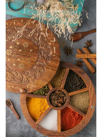 A beautifully crafted wooden spice box, shot for a product brand. The focus here is on the rich colors and textures of the spices, creating an image that speaks to quality and authenticity.