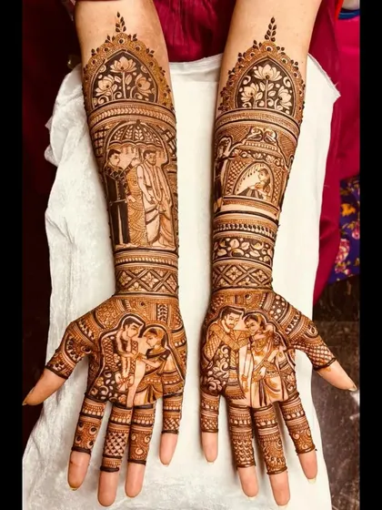 A personalized bridal mehendi design that focuses on the couple. Their portraits are featured on the palms, with scenes from the groom's procession on the forearms.