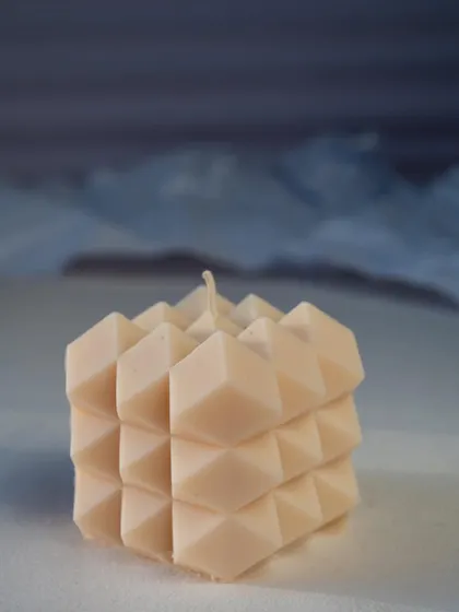 Embrace the beauty of simplicity with our candles. This geometric cube candle has such a unique and interesting texture.