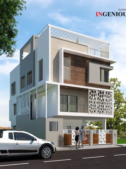 Featuring a prominent white frame and honeycomb-patterned jalli screens, this residence design is both modern and decorative. The layout includes a recessed ground floor and a covered rooftop terrace.
