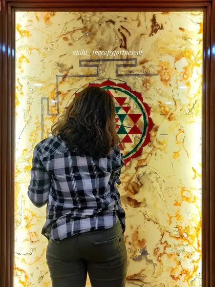 A candid shot of me working on the fine details of the Sri Chakra. Creating spiritual art is a meditative process that requires immense concentration.