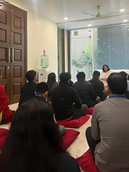 Participants listening intently during a session at our South Extension meet. The environment is created to be calm and receptive, allowing for genuine connections to form.