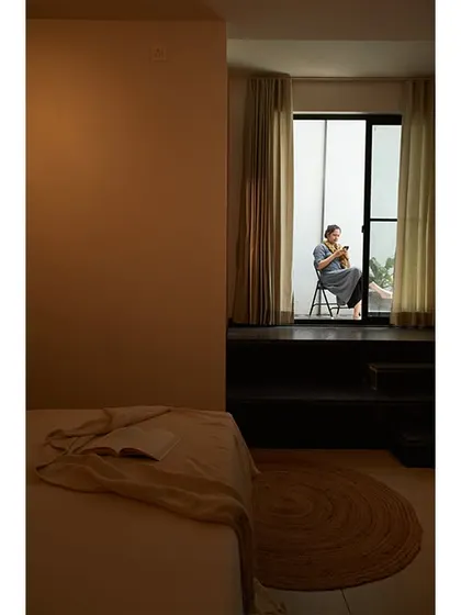 This bedroom nook provides a private space to enjoy the view and a quiet moment.