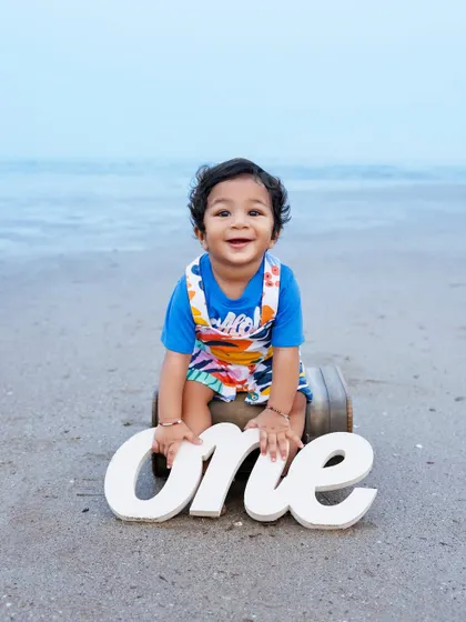 Celebrating a first birthday is a huge milestone, and what better place than the beach? I love using natural light and simple props to keep the focus on your little one's joyful spirit. This outdoor baby photoshoot is perfect for capturing their personality.