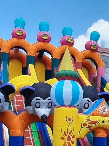 A full view of the top section of my large Mickey Mouse slide. The multiple character heads and bright colors make it look impressive from a distance, attracting kids at any event.