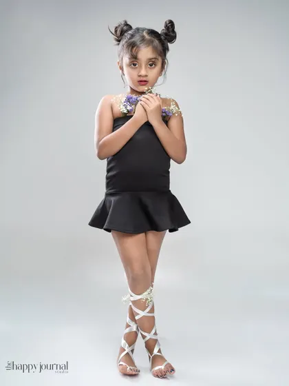 Another look from our creative studio session, this full-length portrait shows off the unique styling and the child's natural poise. These themed shoots are wonderful for creating standout images.