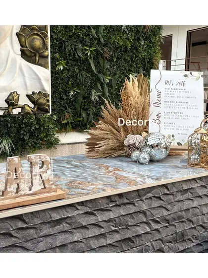 The bar setup for the disco party, featuring a textured bar front and a custom 'BAR' sign.