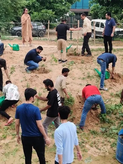 The team from Estee Advisors gets to work, planting 500 native Aravali saplings at Aravali Creek in Sector 42.