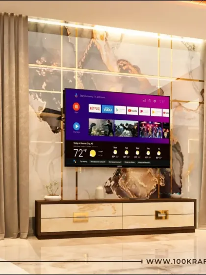 A closer look at a luxurious TV unit, where a dramatic marble-patterned backdrop is framed by elegant gold-toned inlay. This design element adds a touch of opulence to the living space.