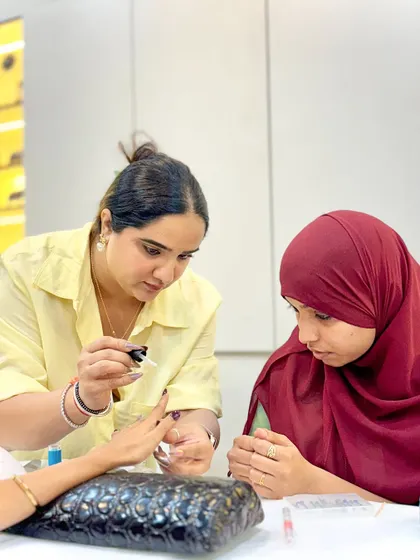 Another angle of our trainer guiding a student. We believe in teaching by doing, and our trainers are always there to support our students' practical work.