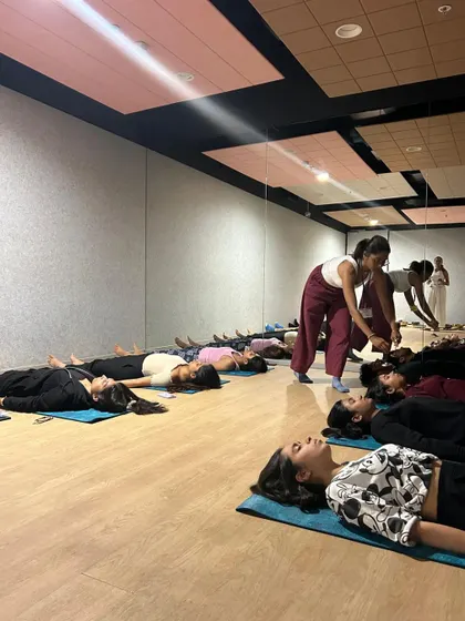 During a corporate wellness workshop, I guide employees through a relaxation exercise. These sessions are designed to be a reset button, helping teams manage workplace stress and improve focus by introducing simple mindfulness techniques.