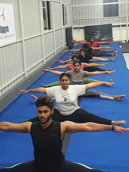 Our adult class works on middle splits, a challenging stretch that greatly improves hip flexibility. We believe in pushing your limits to see what you're capable of.
