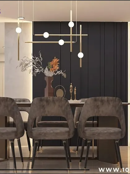 The dining area of the 'Zen Glam' project, featuring plush velvet chairs and a modern linear chandelier. The dark paneled wall adds depth and drama to the space.