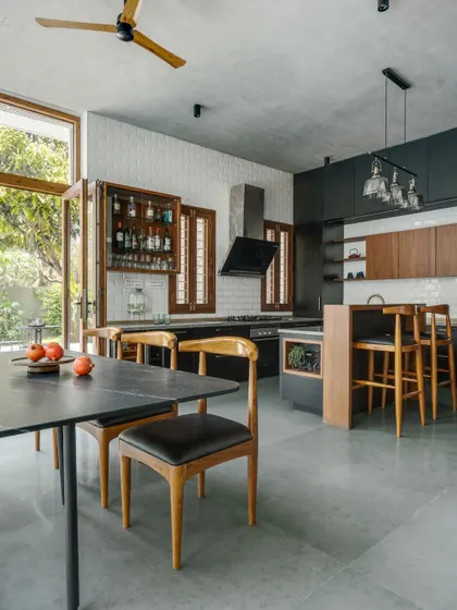 A kitchen should be both beautiful and functional, seamlessly connecting to the life of the home. This open-plan kitchen and dining area extends into the garden, blurring the line between indoor and outdoor living.