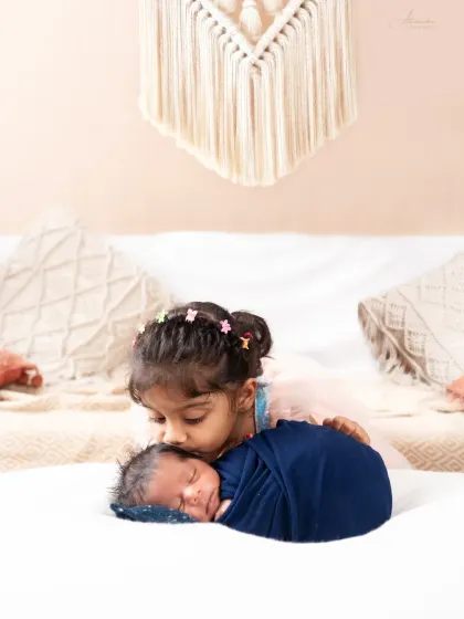The gentlest kiss for a new baby brother or sister. Capturing the first moments of a lifelong sibling bond.