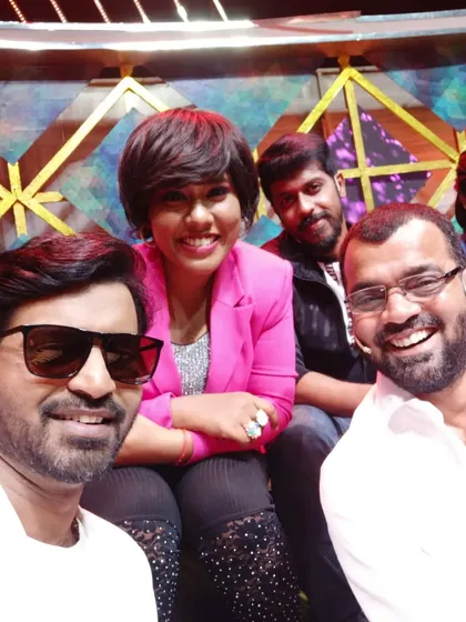 A happy group selfie with fellow artists on set. The collaborative energy and camaraderie behind the scenes are what make these shows so special.