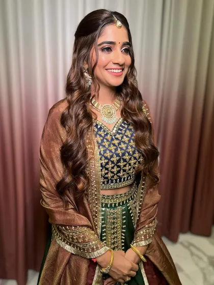 Tulsi's smile is so bright! Her makeup is glowing and she looks ready for the wedding week to begin.