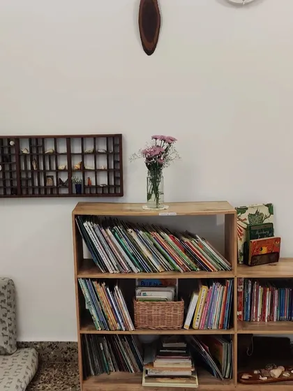 Our reading corner, with a curated collection of books and natural treasures on display. We create cozy, beautiful nooks that invite quiet exploration and a love for stories and learning.