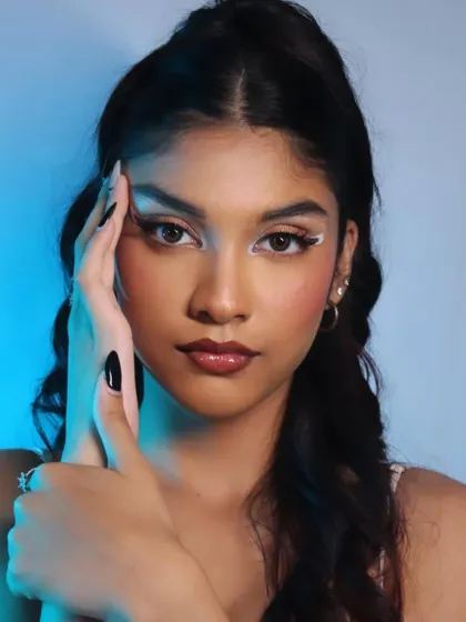 Playing with cool-toned lighting to enhance the modern, edgy feel of the makeup.