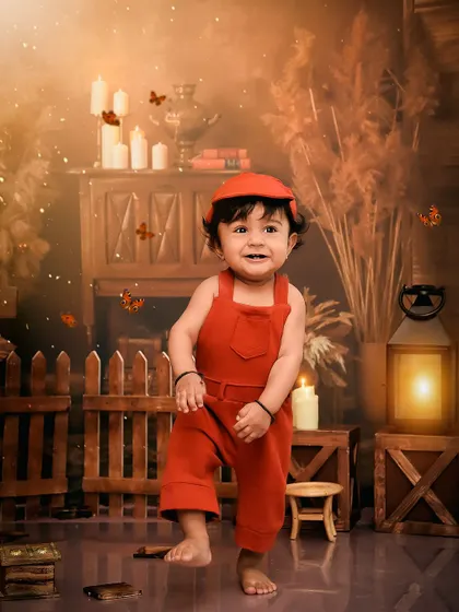 A happy dance in his rustic-themed birthday setup. The warm, earthy tones and soft lighting create a beautiful and natural feel.