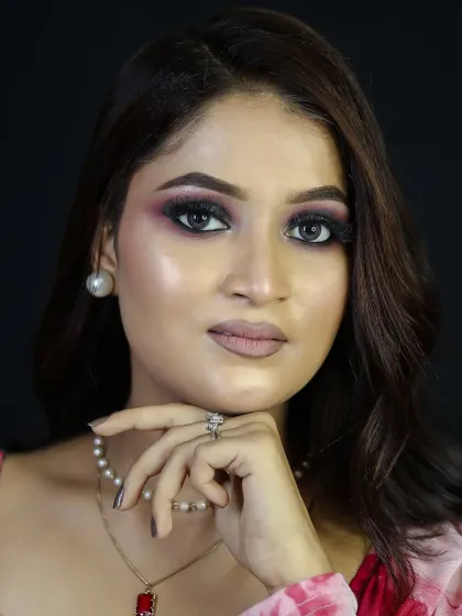 A close-up portrait that highlights the shimmer and dimension of the eye makeup.