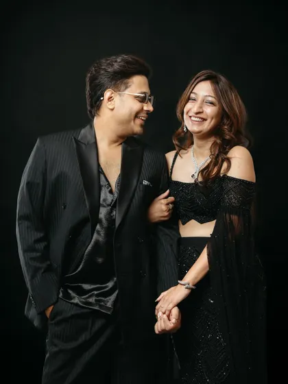 This image captures a beautiful, spontaneous moment of laughter during a studio session. The couple's genuine smiles and easy chemistry shine against the dark background, showing how I capture authentic emotions even in a controlled setting.