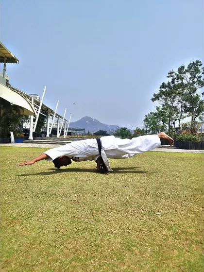 This is what mastery of the body looks like. The one-hand Mayurasana, or Peacock Pose, is an advanced calisthenics and yoga posture that requires immense core strength, balance, and focus, all of which we develop in our training.