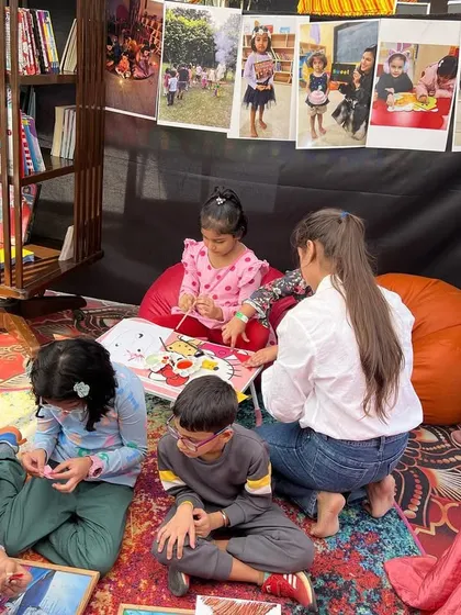Our booth at the Kukdukoo fest was a hub of activity, with kids gathering on beanbags for reading and crafting sessions.