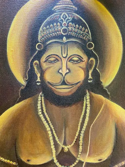 A close-up of the Hanuman painting, focusing on his serene, smiling face.