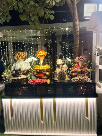 The fruit counter at night, beautifully illuminated.