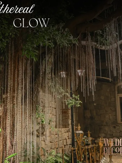 A simple yet powerful installation. We draped long strands of delicate lights from the branches of an old tree, transforming it into a natural weeping willow of light that looked absolutely magical.