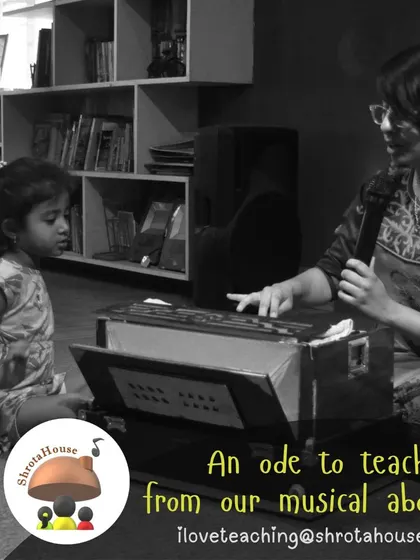 A young girl gets her first lesson on the harmonium, her expression a mix of concentration and delight. We introduce children to a wide range of keyboard and string instruments.