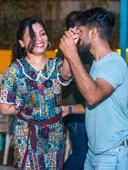 A fun, colorful dress and a big smile. The fashion on the dance floor is as vibrant as the music.