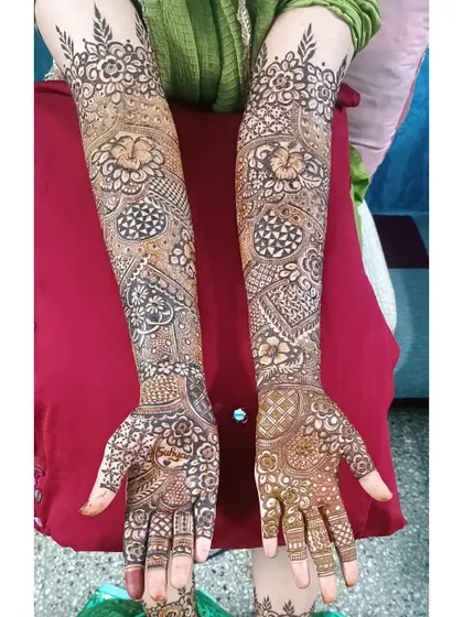 Another view of a heavy floral design, showcasing the symmetry and density of the patterns on both arms.