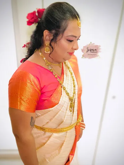 An elegant makeover for a guest attending her brother's wedding. The makeup is classic and timeless, paired with a traditional saree and hairstyle.
