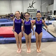 A group of our Level 4 gymnasts looking proud at the State Championships.