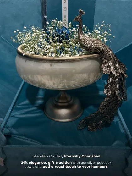 Intricately crafted, eternally cherished. This graphic emphasizes the regal and traditional appeal of my silver peacock bowls, a perfect way to add a touch of heritage to your hampers.