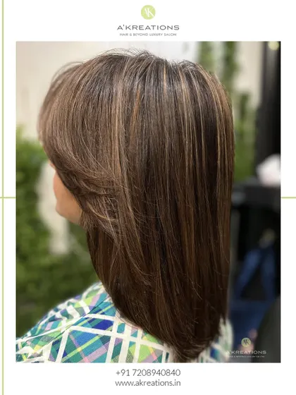 Dark brown meets mocha in this perfect blend of elegance and style, finished with a sleek, modern haircut.