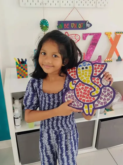 So proud of her finished Ganesha mosaic! My kits are a wonderful way for kids to create vibrant, personalized decor for festivals or just to brighten up their space.