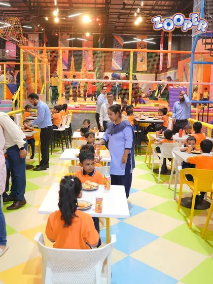 My spacious food court can handle large groups, like this school trip. I make sure nobody goes hungry after a day of fun.