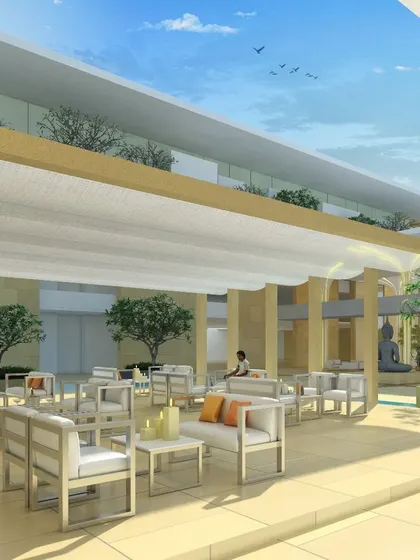 This render envisions the outdoor seating area of a clubhouse in Bangalore. The design combines minimalist grandeur with comfortable lounge furniture, creating a sophisticated space for social gathering and relaxation.
