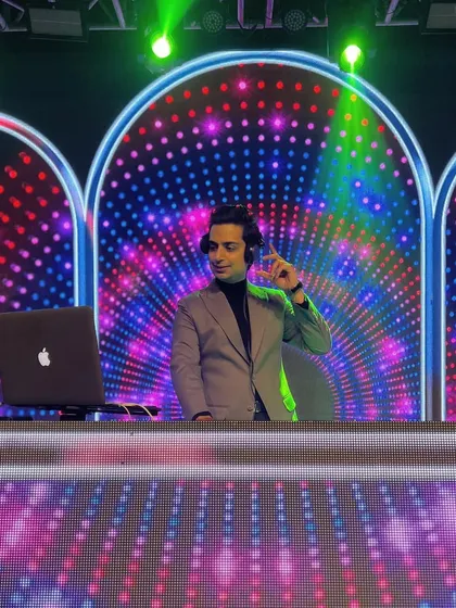When work is your passion, life becomes an adventure. A shot of me against a colorful, retro-inspired LED screen, living my dream.