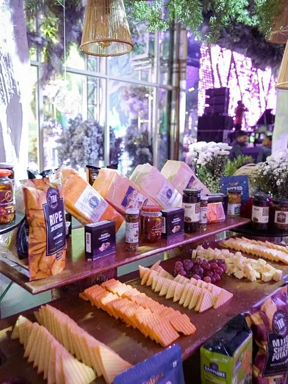 Another view of our extensive cheese board, featuring a wide selection of imported and local cheeses, fruits, nuts, and crackers. It's a perfect centerpiece for a cocktail reception.