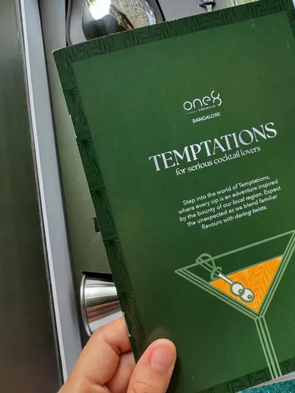 A close-up of the branded insert for the One8 "Temptations" cocktail kit. We design and include custom print materials like menus and thank you cards to communicate your brand's message effectively.