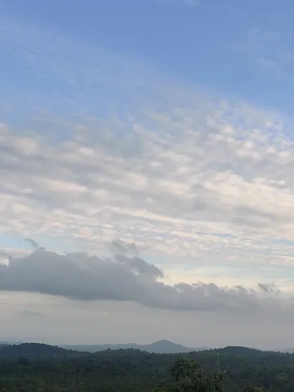 The beautiful cloud-filled sky over the hills, a common sight on our heritage treks.