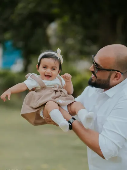 These are the moments that matter most. A father's joy as he plays with his daughter during her first birthday outdoor session. I always make sure to capture these precious family connections.
