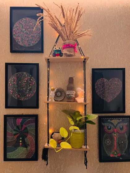 A view of my art wall, showcasing a variety of framed mandala pieces. If you're interested in adding a unique piece to your space, I can create custom art for you.
