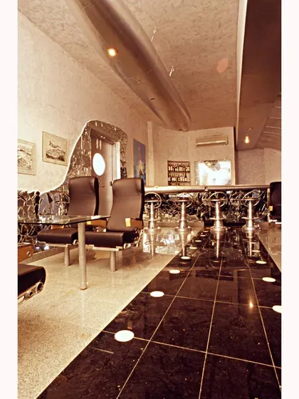 The Aste Bar was born from abandoned aircraft wreckage. We repurposed airplane seats and fuselage parts to create a unique and immersive experience, rewriting the context of these discarded materials.