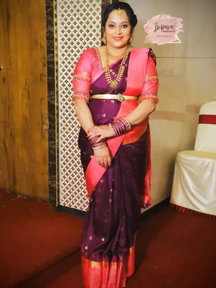 A full-length view of the client's look for the naming ceremony, showcasing the perfectly draped saree.